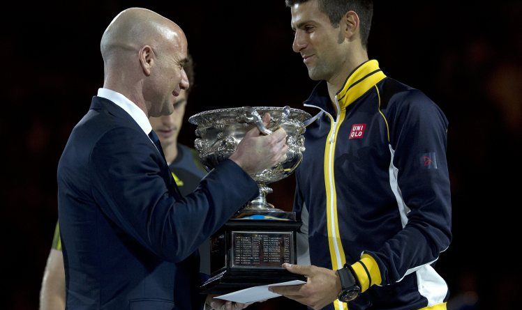 trophy to Novak Djokovic